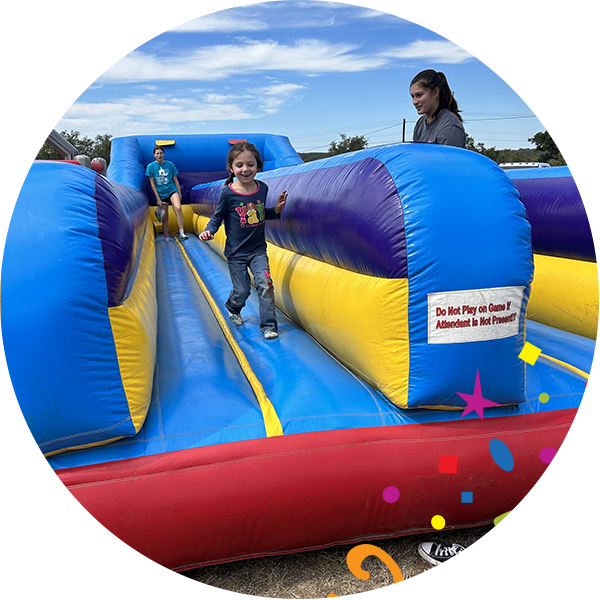 Kid running in inflatable fun run